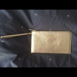 Michael Kors large zip clutch in pale gold.